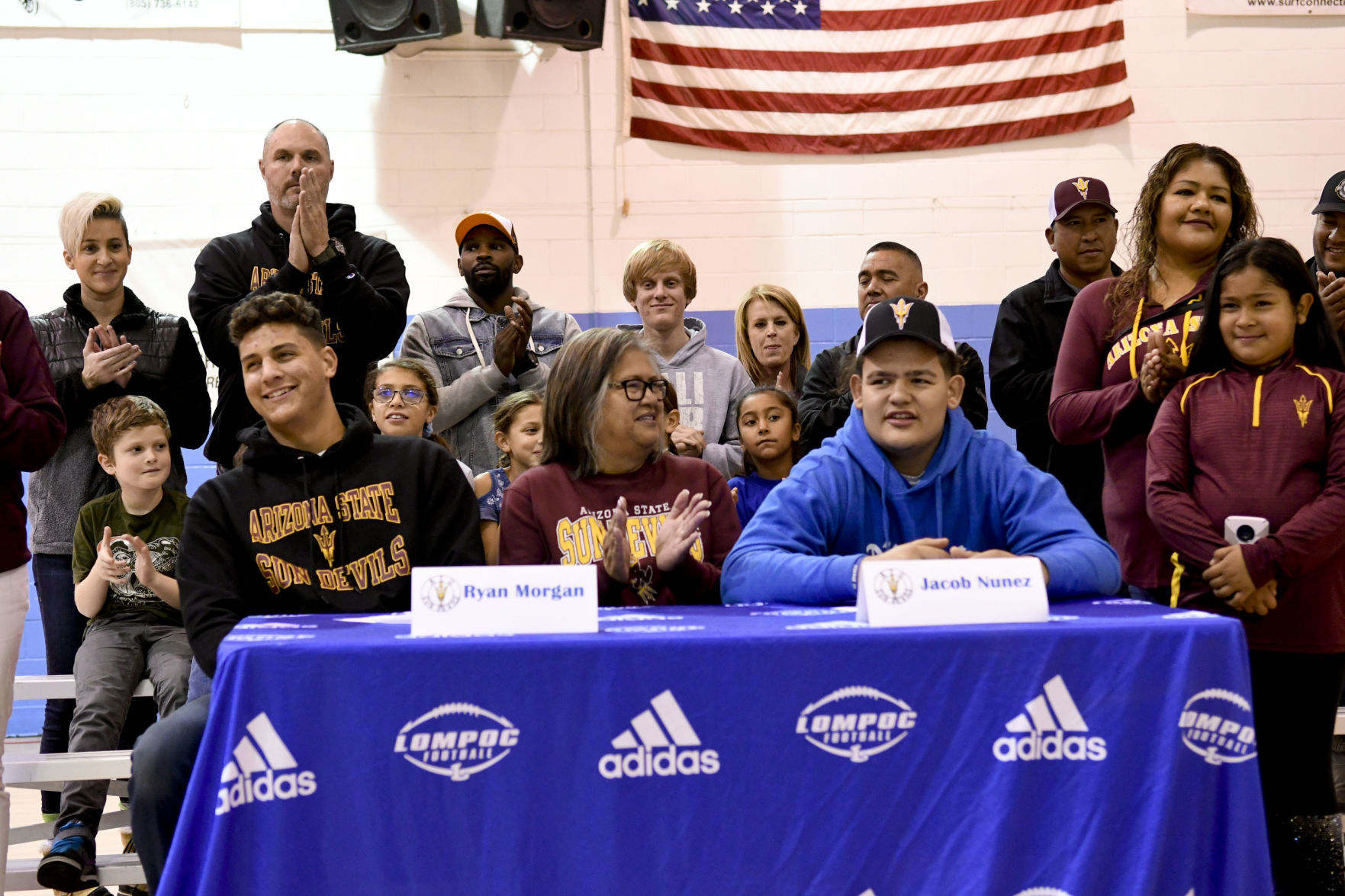 121819 Morgan and Nunez sign 14.jpg